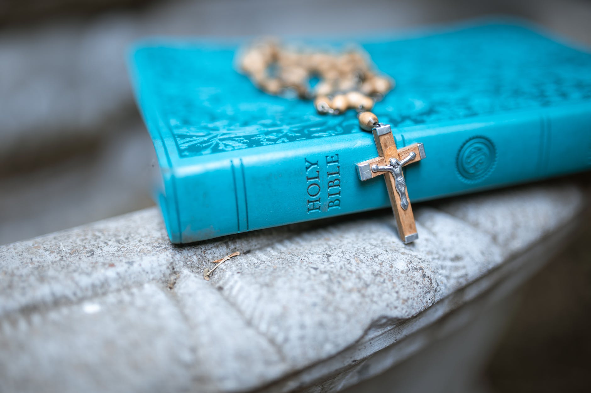 rosary on holy bible